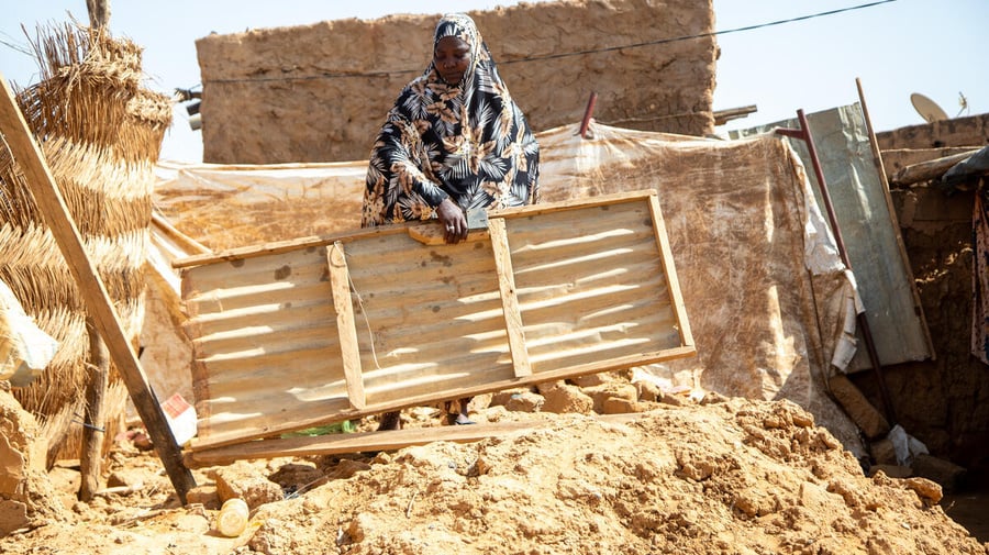 Niger. A malian refugee in the ruins of her home that was swept away by flood waters