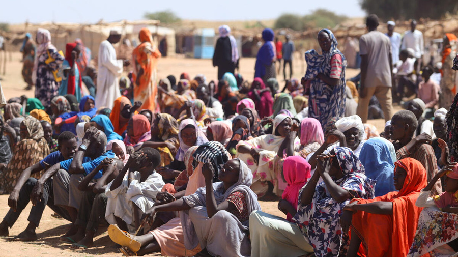 People who recently fled fighting in El Fasher and surrounding areas wait for assistance in Tawila, in Sudan's North Darfur State.