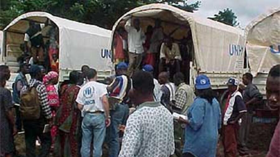 Liberian refugees boarding trucks for the Gbargbo refugee camp in Sierra Leone.