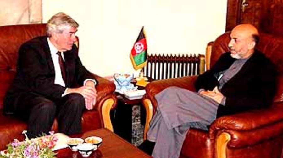 UN High Commissioner for Refugees Ruud Lubbers with Chairman Hamid Karzai of the Afghan Interim Administration at the presidential palace in Kabul on Tuesday.
