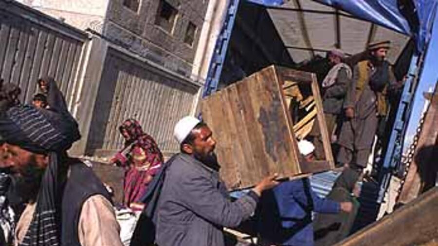 The last 2,697 internally displaced Afghans leaving the Soviet compound in Kabul last week for their villages in the Shomali plain.