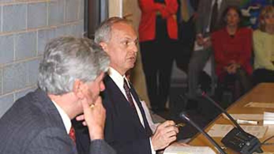 Arthur Helton presents his book to High Commissioner Lubbers (left) and UNHCR staff in Geneva.
