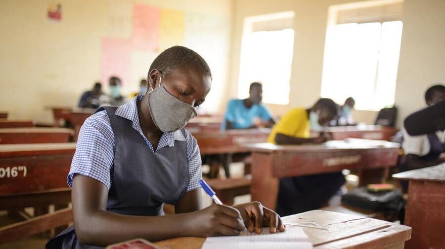 A South Sudanese refugee student attends primary school in a refugee settlement in Uganda.