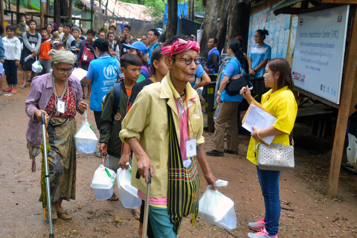 Thailand. Voluntary returnees leave shelters, bound for Myanmar