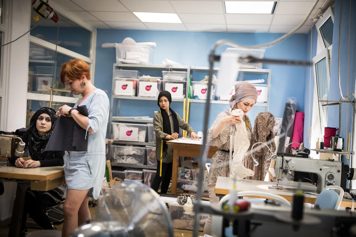 Germany. Refugee women got a job as a seamstress in a Frankfurt fashion workshop.