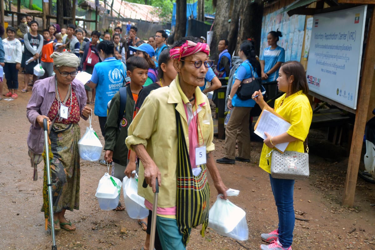 Thailand. Voluntary returnees leave shelters, bound for Myanmar