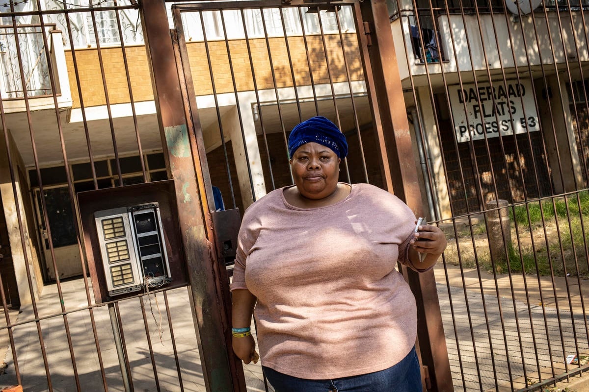 South Africa. Volunteer distributes food to homeless people and refugees