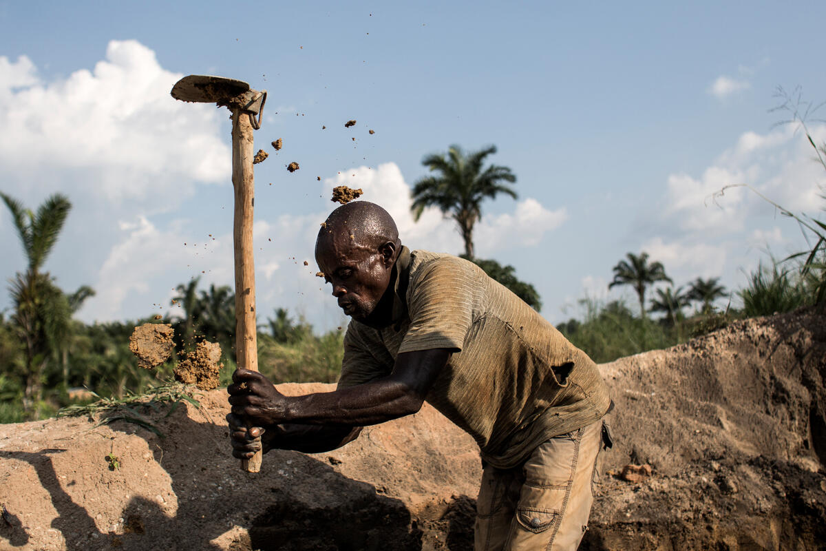 Democratic Republic of Congo. An internally displaced man is seen working at a artisinal brick making factory.