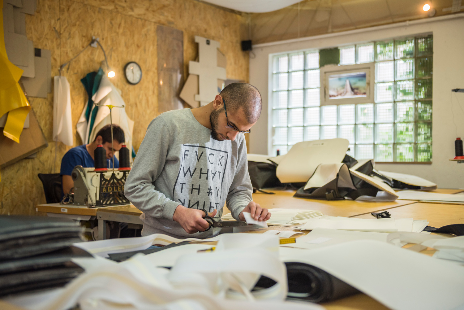 Germany. Syrian father and son use sewing skills to start new lives