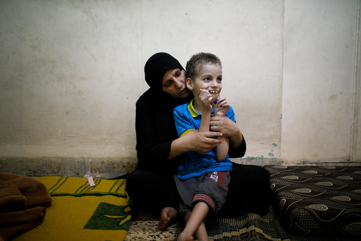 Jordan. A group of refugee women make sweets for Eid and distribute to needy families