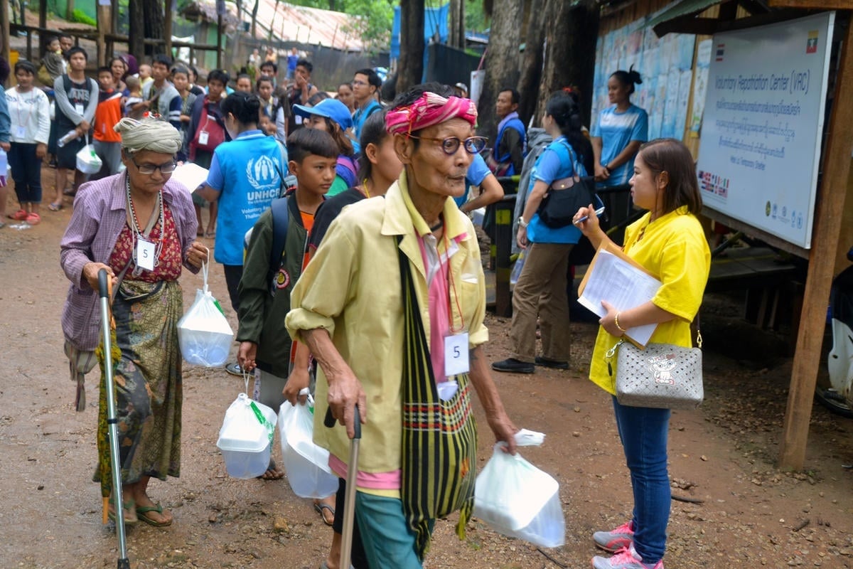 Thailand. Voluntary returnees leave shelters, bound for Myanmar