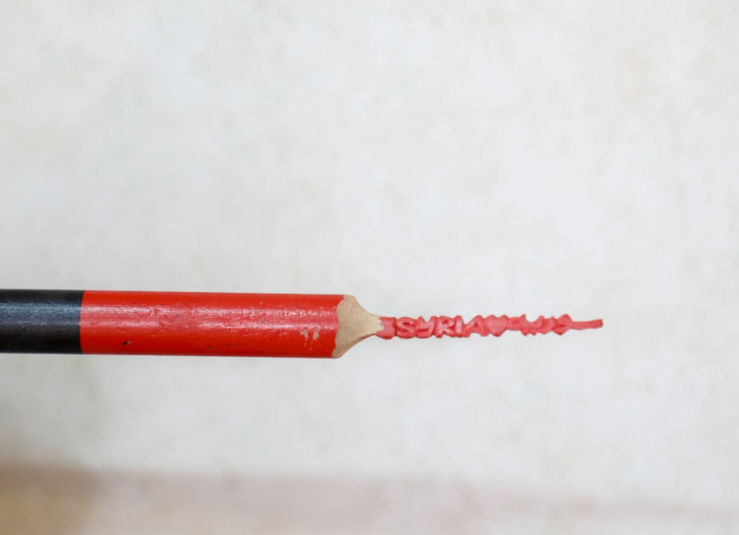 A pencil carved by artist Tarek Mohamed Hamden who lives in Za'atari Camp. Tarek was forced to flee from Syria in 2012