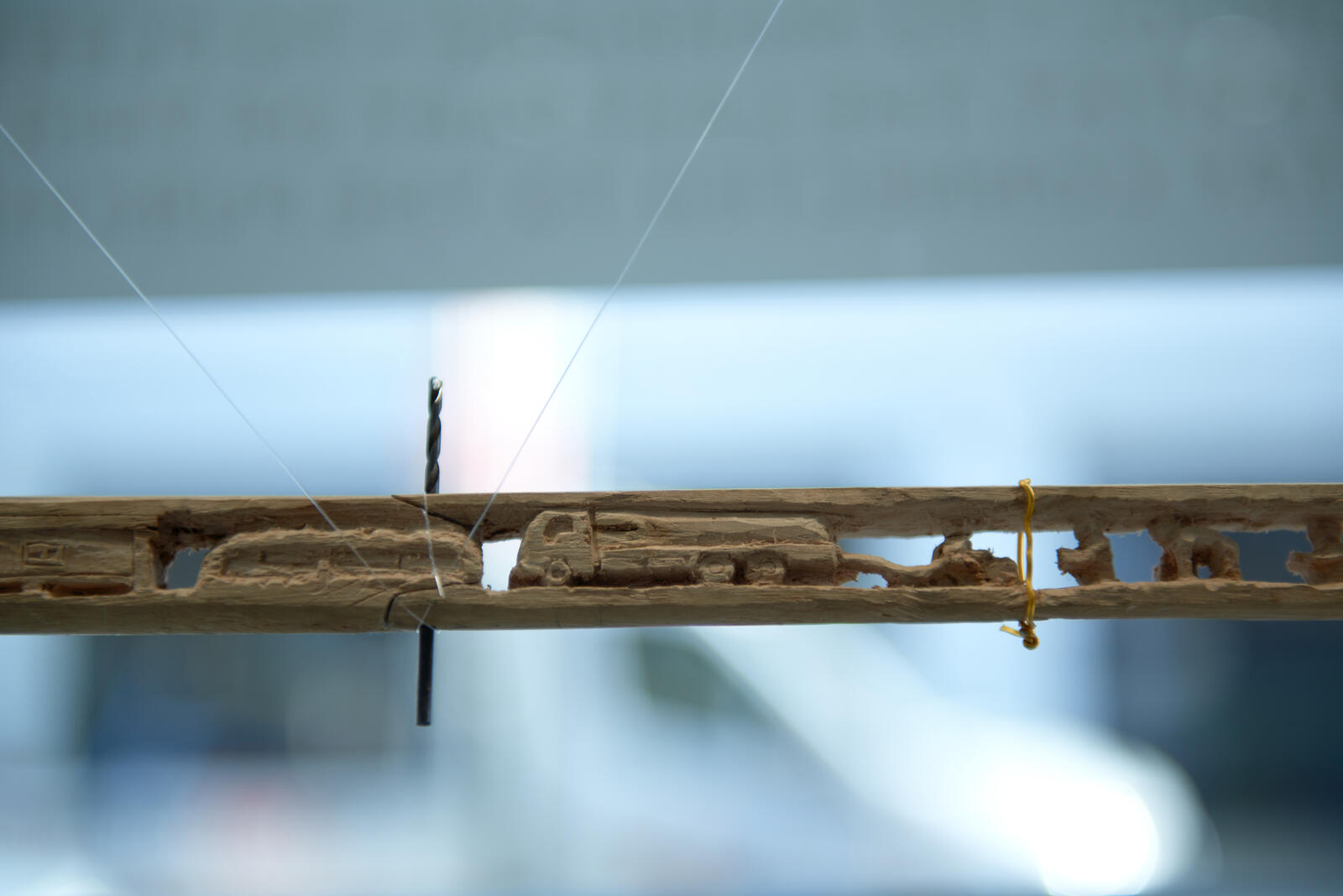 This broomstick, carved by Tarek Mohamed Hamden, tells the story of his life. In 2012 Tarek and his family fled Syria and arrived in Za'atari Camp. 