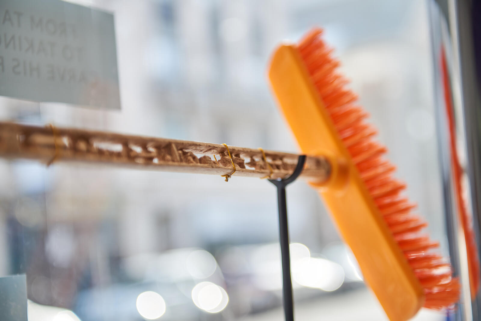This broomstick, carved by Tarek Mohamed Hamden, tells the story of his life. Through a partnership with Professor Helen Storey his work is being exhibited and sold in London.