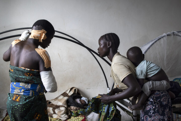 Madeleine recovering in hospital after the attack on her village in March 2022. Her four children were among 17 people killed.
