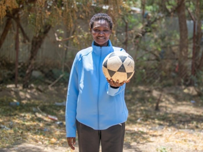 A girl holding a ball