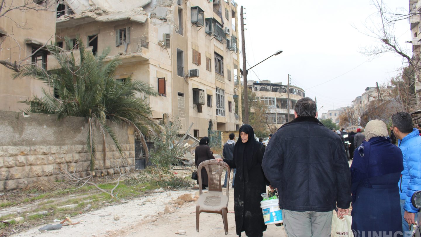 People from East Aleppo visits to check on their damaged houses