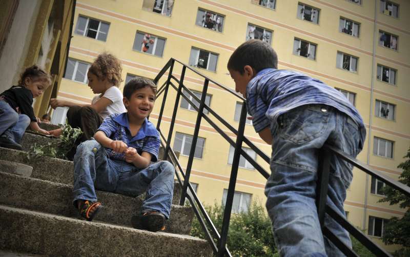 Young asylum-seekers play in front of a reception and integration centre in Bulgaria.