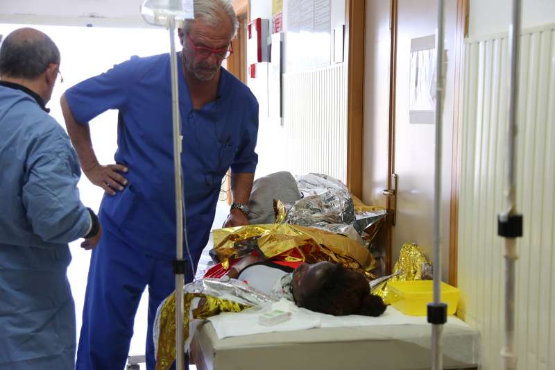 Burns victims are tended to by staff at a clinic on Lampedusa Island.