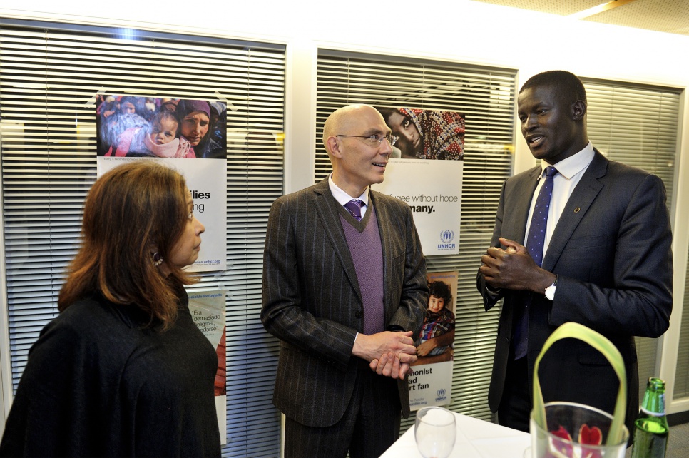 Reception in honour of members of UNHCR's inaugural Advisory Group on Gender, Forced Displacement and Protection. UNHCR Assistant High Commissioner, Volker Turk in discussion with advisory group members Victor Ochen from Uganda and Marina Mahathir from Malaysia.