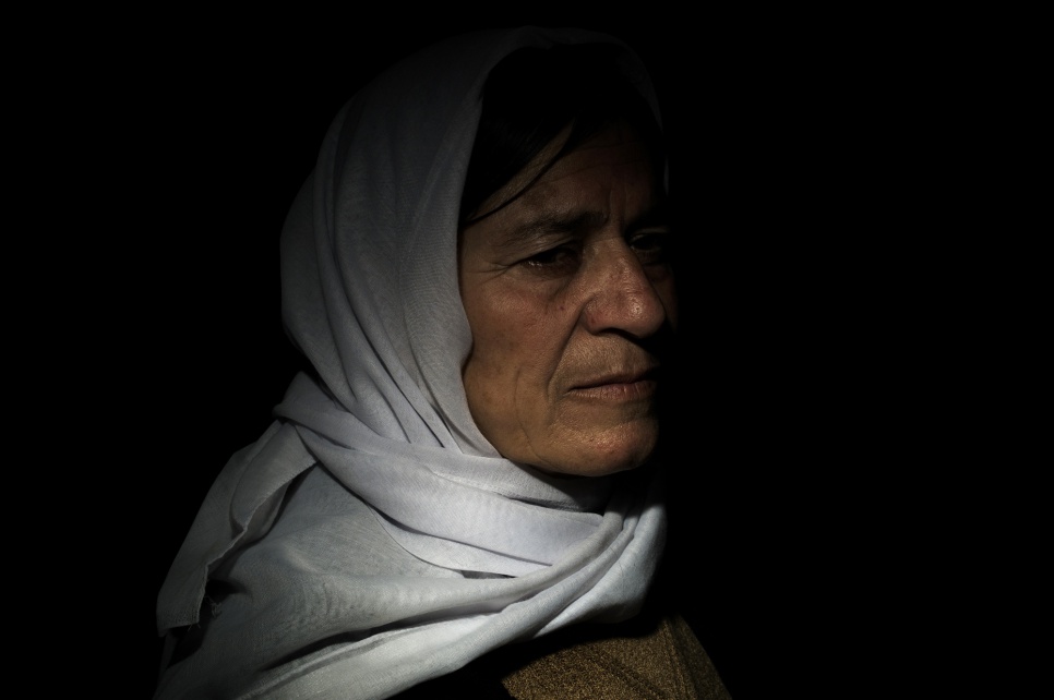 An unnamed Yazidi woman bides her time in Khanke camp near Dohuk in the Kurdistan region of Iraq (KRI). She endured a painful wait as her family members were held captive by rebels.