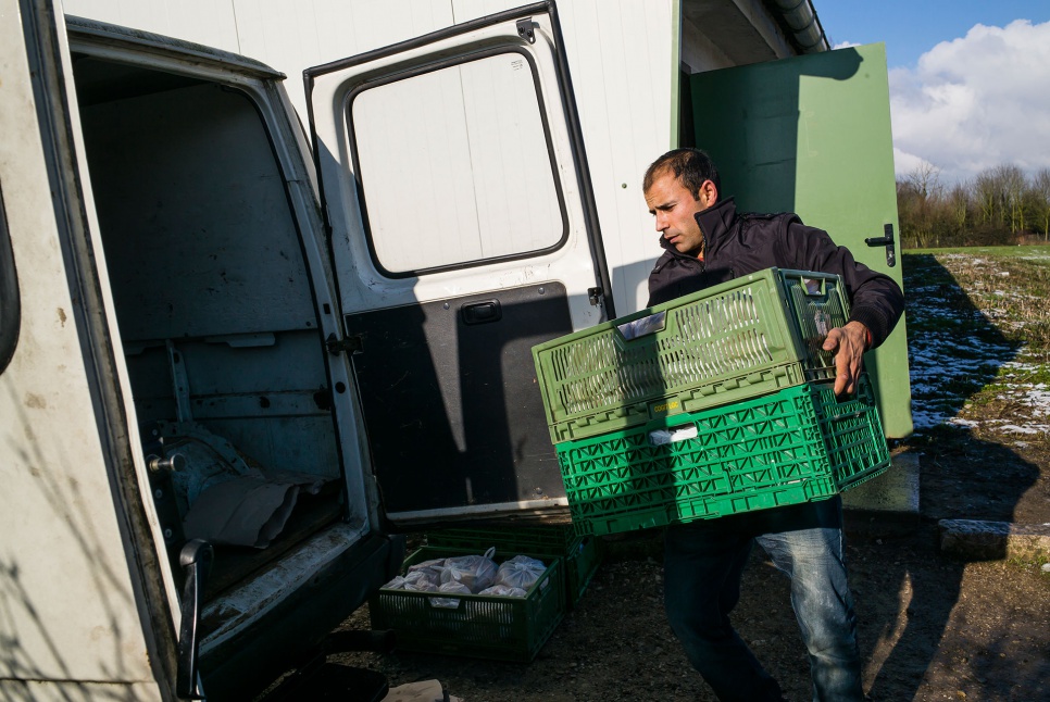 Rahman Jan, who works with Auberge des Migrants, helps prepare food for refugees and migrants in Calais.