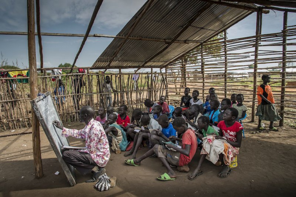 To accommodate the large number of students, Alaak teaches one class in the partially built Anglican Church, adjacent to the two classrooms he has already set up.