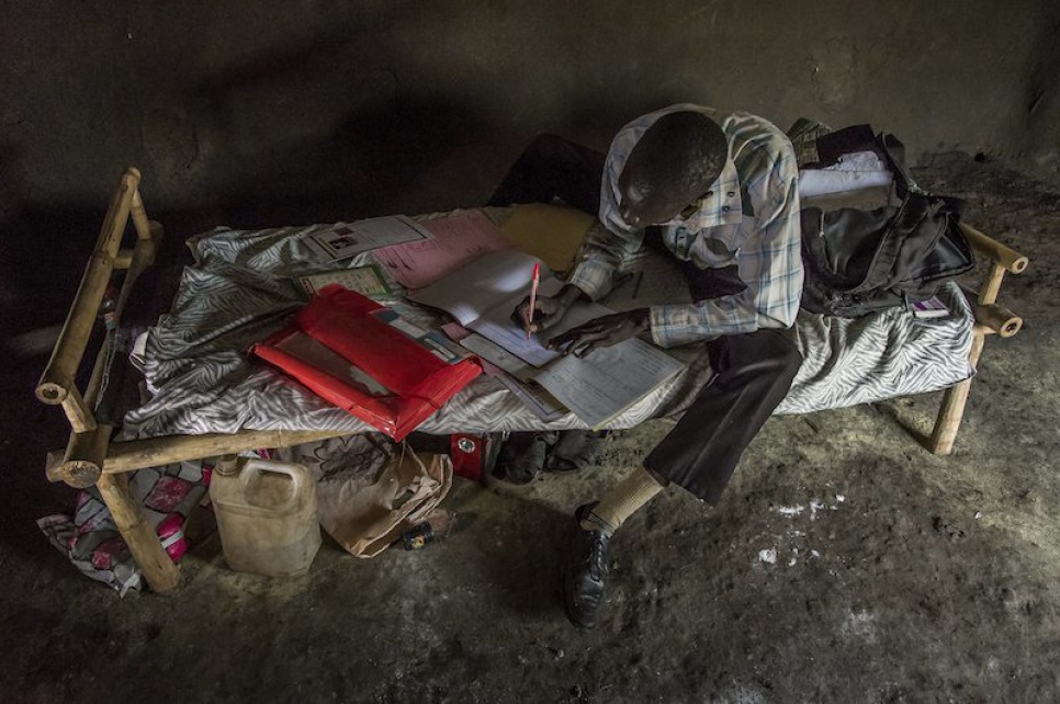 Alaak wakes each morning at 6 a.m. After washing, he makes his bed and finishes his lesson plans for the day.