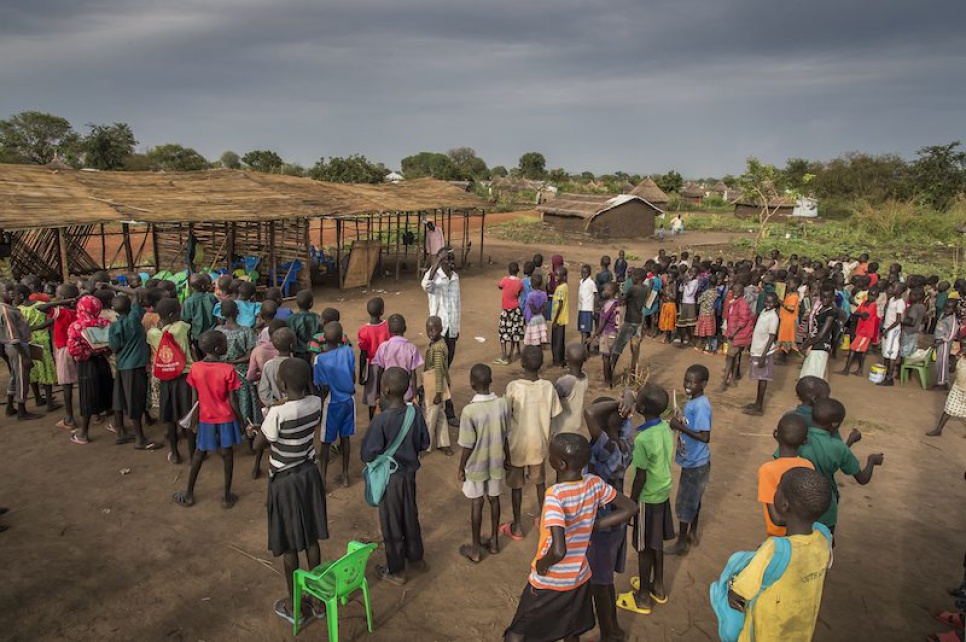 Alaak welcomes pupils to his school at Nyumanzi refugee settlement in Uganda.