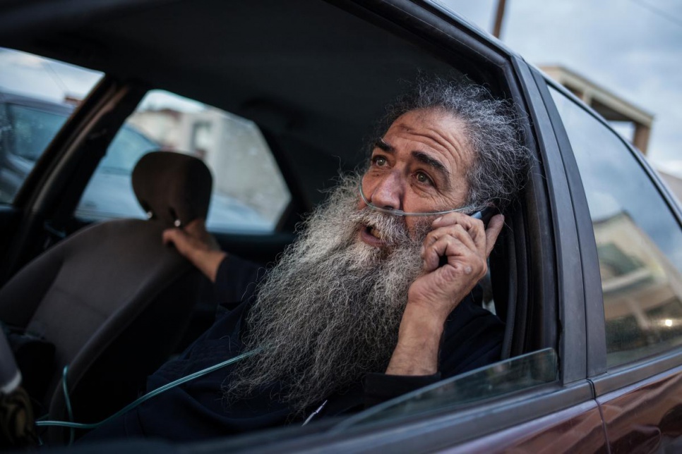 Father Stratis calls his car "Tarzan" for its ability to scramble onto the island's most inaccessible corners. He packs food, water and spare clothes to help people newly arrived on the island.