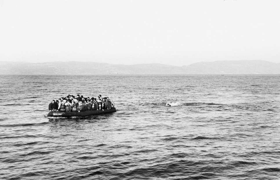 A overcrowded boat carrying Syrian refugees heads to the shore. One Syrian man had fallen from the boat, he was later rescued by volunteer Spanish Lifeguards.