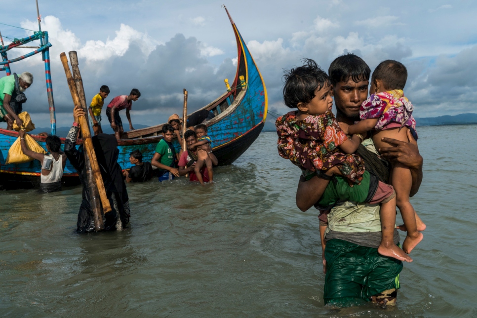 Bangladesh. Rohingya fleeing Myanmar by boat land on beach