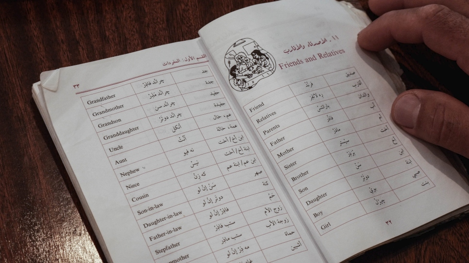 Now resettled in the UK, Talal's exercise book helps him to practise English every day.