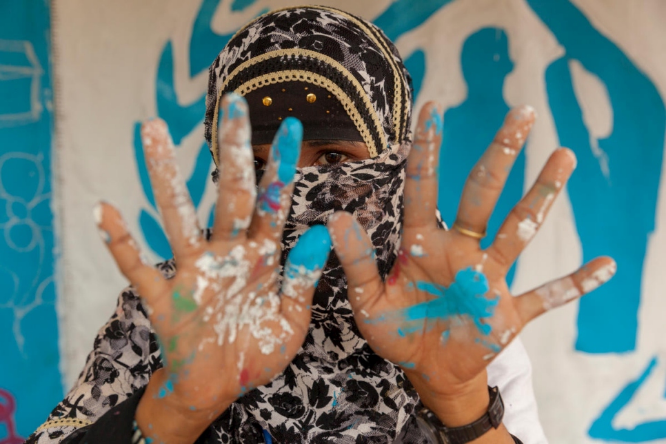 Bangladesh. Painting a UNHCR tent