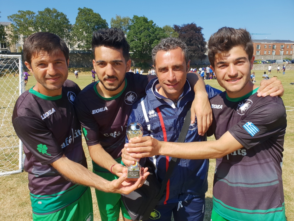 Players of the Syrian Café Rits Team holding the Fair Play Trophy, awarded to the team that best embodies the spirit of good sportsmanship at the annual tournament. 