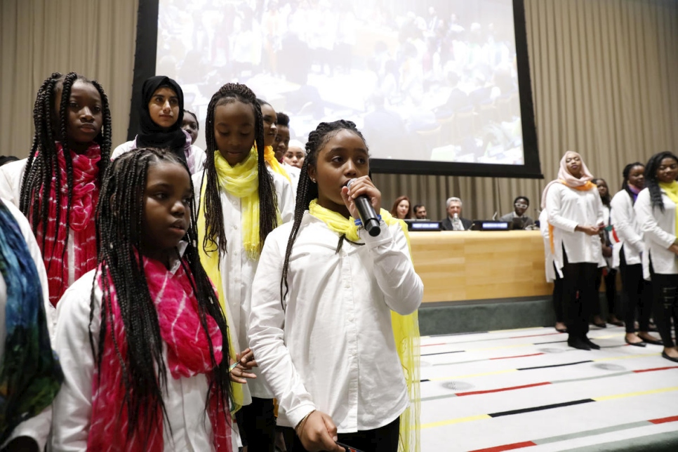 United States. The Global Compact on Refugees is approved by the UN General Assembly at the United Nations Headquarters in New York. The moment was commemorated with a special event including *senior* leaders from the UN, alongside refugees and a choir of young refugees and migrants.