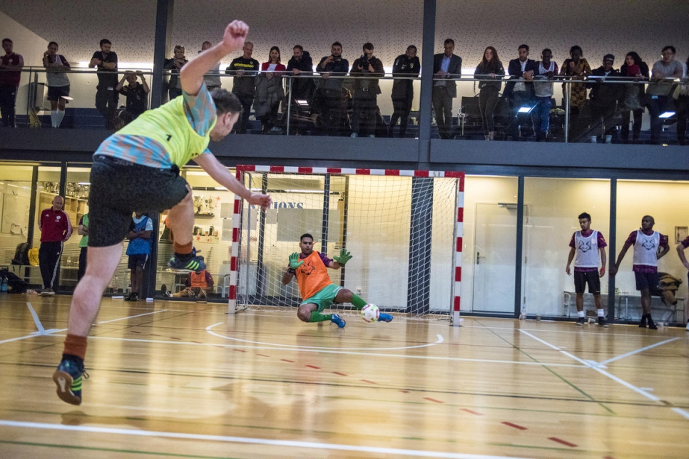 Switzerland. Mixed teams size each other up for indoor football tournament