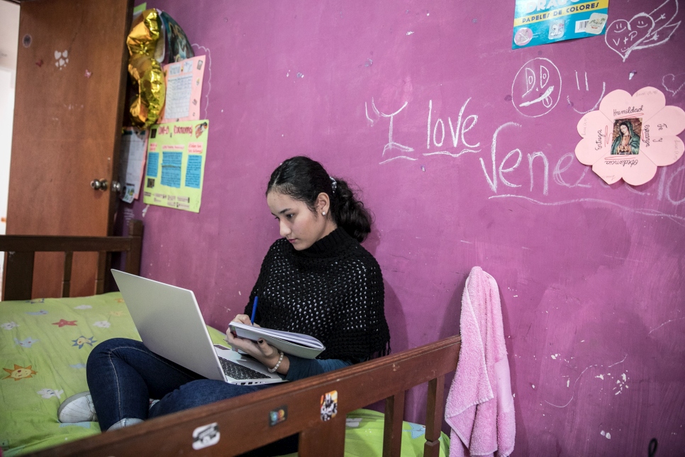 Venezuela refugee Yvana Portillo, 15, studies in her bedroom at home in Lima, Peru. Now aged 15, she fled Venezuela with her family in 2017. Now living in the Peruvian capital Lima, she has thrived in her new surroundings and is top of her class in high school, emerging as an advocate for accessible, quality education. 