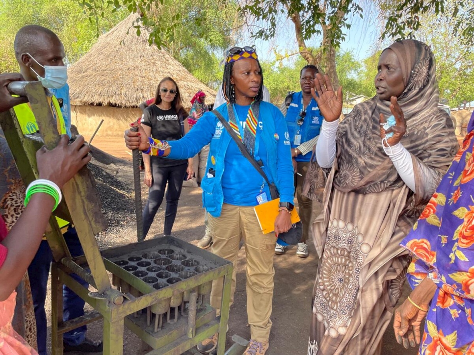 Juliette Murekeyisoni, UNHCR's Deputy Representative in South Sudan, meets with members of the Gendrassa briquette production group.