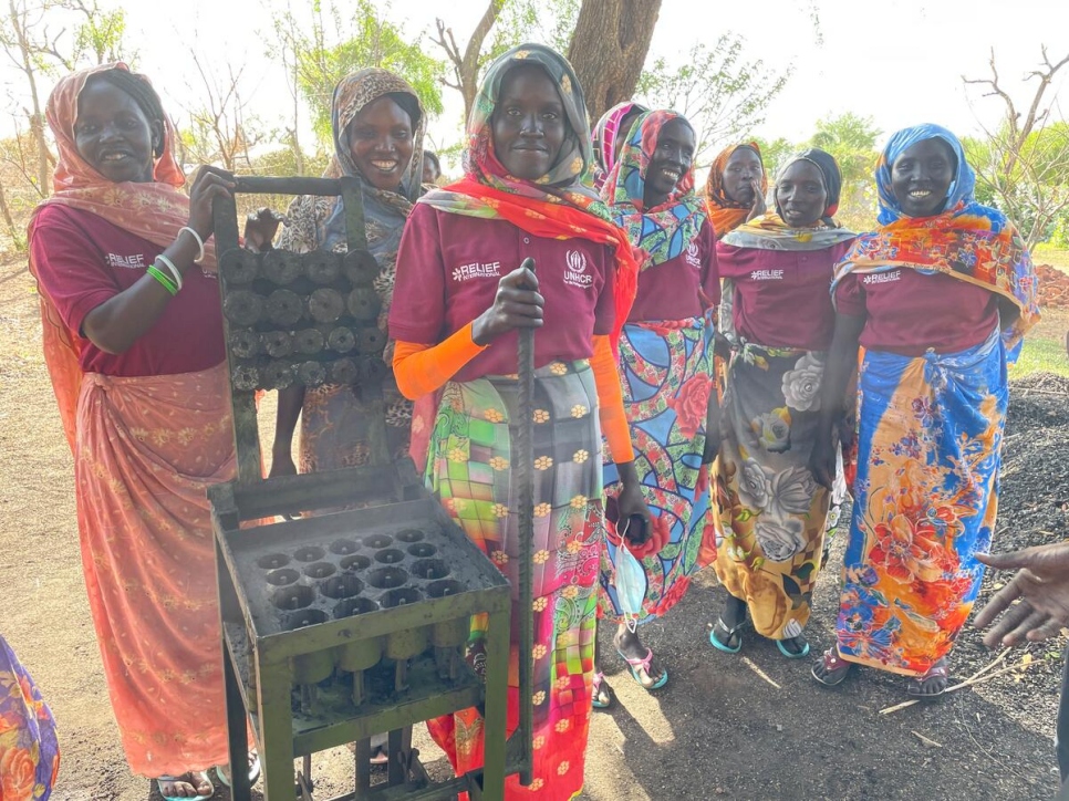 Members of the Gendrassa briquette production group come together at the Gendrassa business hub in Maban to make briquettes.