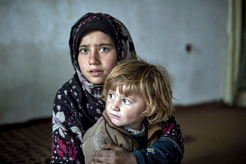 Nine-year-old Fauzia* and her three-year-old sister Aseela* in their temporary accommodation in Kabul. *Names have been changed.