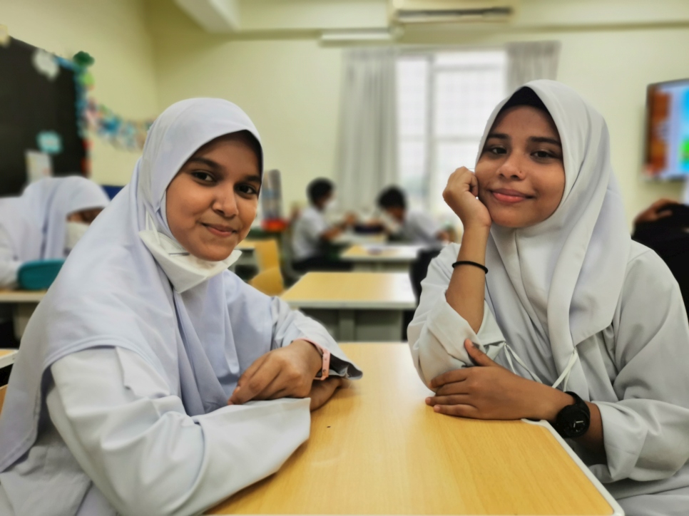 Onasisah and her best friend, Khushidah in their classroom.