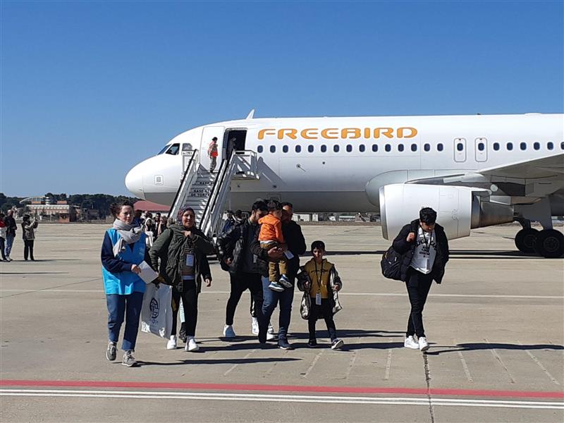 UNHCR, the UN Refugee Agency, and the International Organization for Migration (IOM) welcoming a group of 89 Syrian refugees at Torrejón military airport in Madrid.