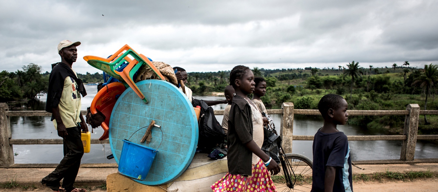 Democratic Republic of Congo. A family of Internally displaced persons are seen on the road whilst fleeing to kananga.