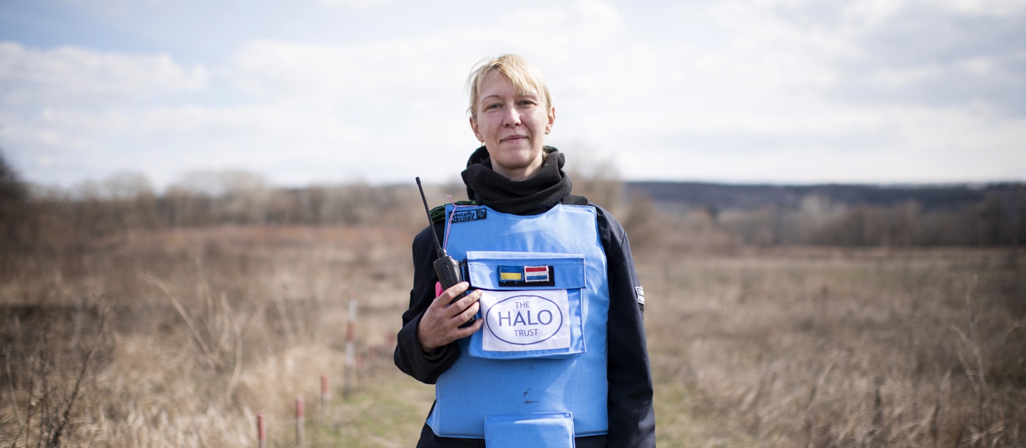Ukraine. A female deminer in partially cleared minefield in the Donbas area