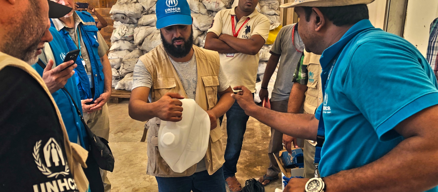 A senior delegation from the Thani Bin Abdullah Bin Thani Al-Thani Humanitarian Fund is briefed on the Core Relief Items (CRIs) distributed to Rohingya refugees in Cox's Bazar in Bangladesh. 
