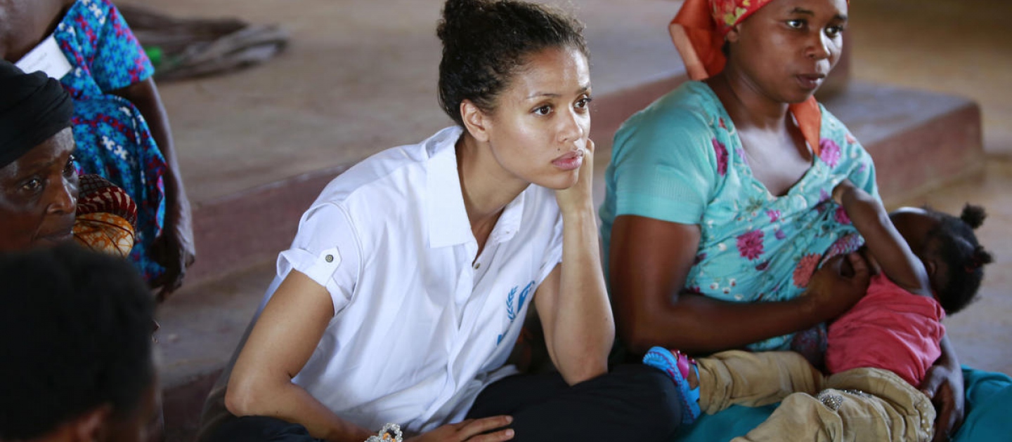 Gugu Mbatha-Raw at the Women's Centre in Nakivale Refugee Settlement, Uganda, May 2019, with Sifa Semeki, a refugee.