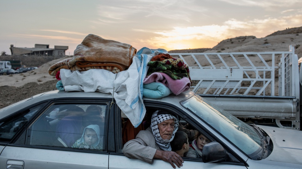 After fleeing fighting near their homes in the eastern districts of Mosul, and Iraqi family arrives by car at Hasansham camp in the Kurdistan Region of Iraq. 