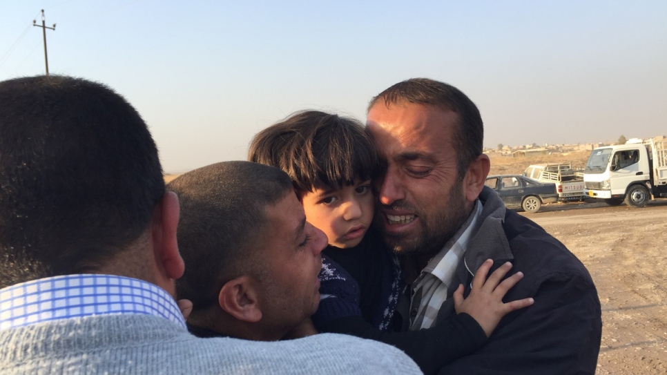 A family of internally displaced Iraqis are reunited at Khazer camp in the village of Hasansham, after fleeing Mosul.