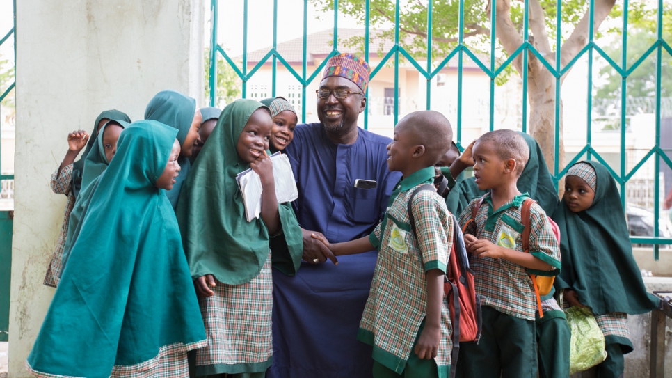 Mustapha and the students of Future Prowess Islamic Foundation School before morning assembly.